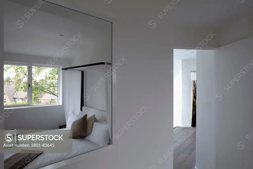 St Mary's Road, London, United Kingdom. Architect: h2 Architecture , 2012. Mirror refection of bedroom.