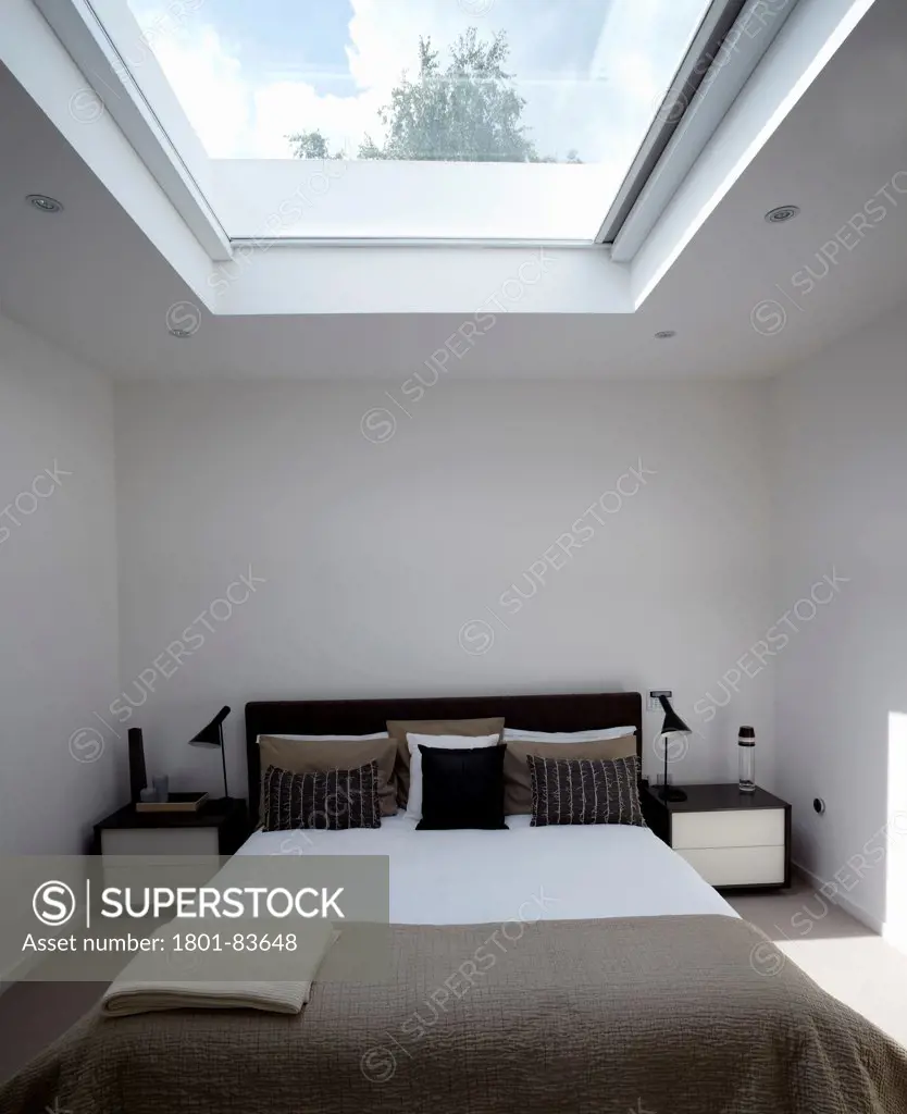 St Mary's Road, London, United Kingdom. Architect: h2 Architecture , 2012. Master bedroom with big skylight, bright with tonal range.
