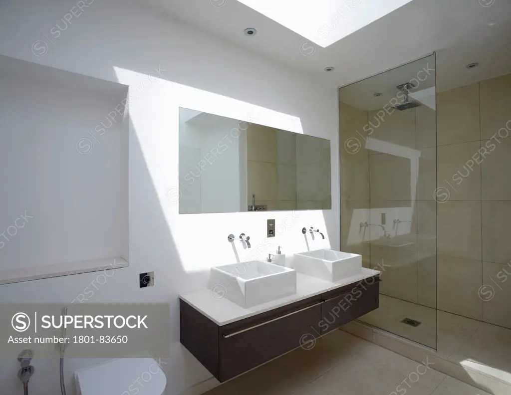 St Mary's Road, London, United Kingdom. Architect: h2 Architecture , 2012. Bathroom with skylight and strong shadows.