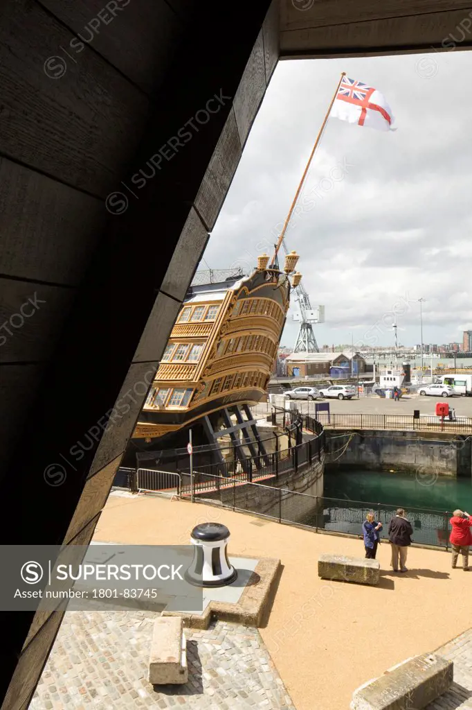 The Mary Rose Museum, Portsmouth, United Kingdom. Architect: Wilkinson Eyre Architects , 2013. External view from balcony towards The Victory.