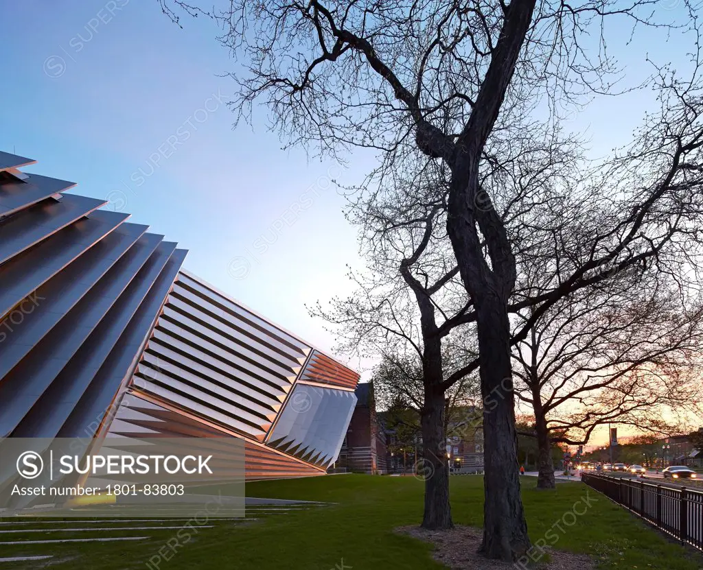 Eli & Edythe Broad Art Museum, Lansing, United States. Architect Zaha Hadid Architects, 2013. One point perspective of pleated steel facade with street scene at dusk.