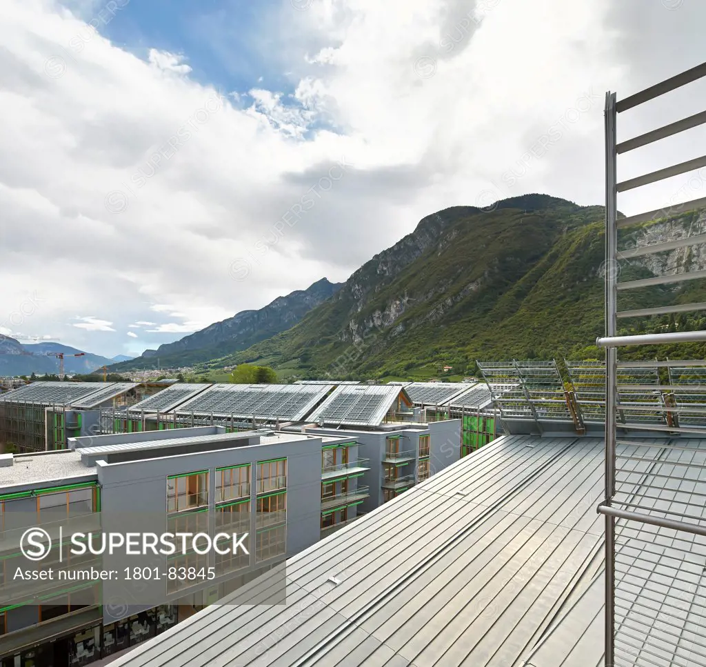 MUSEScience Museum, Trentino, Italy. Architect Renzo Piano Building Workshop, 2013. Roofscape with photovoltaic panelling and mointain range beyond.