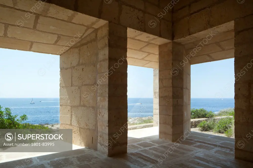 Can Lis, Mallorca, Spain. Architect Utzon, Jorn, 1971. Living Room with 'frameless' windows andview of sea.