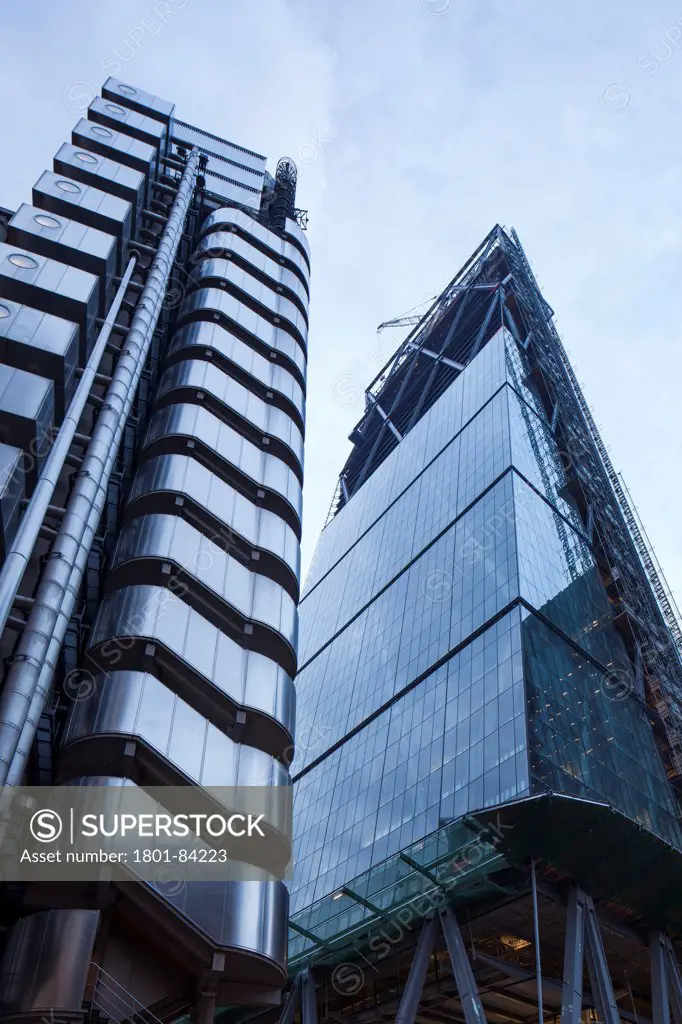 The Leadenhall Building, under construction, London, United Kingdom. Architect Rogers Stirk Harbour + Partners, 2013. Dramaticview looking up at 'the Cheesegrater' with the Lloyds building to the left.