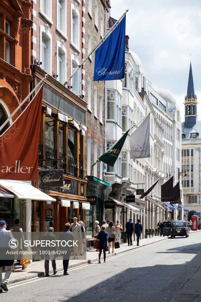 Bond Street, London, United Kingdom. Architect Sir Thomas Bond, 1700. View looking south down the length of Bond Street showing shops and boutiques with flags, signage and people shopping.