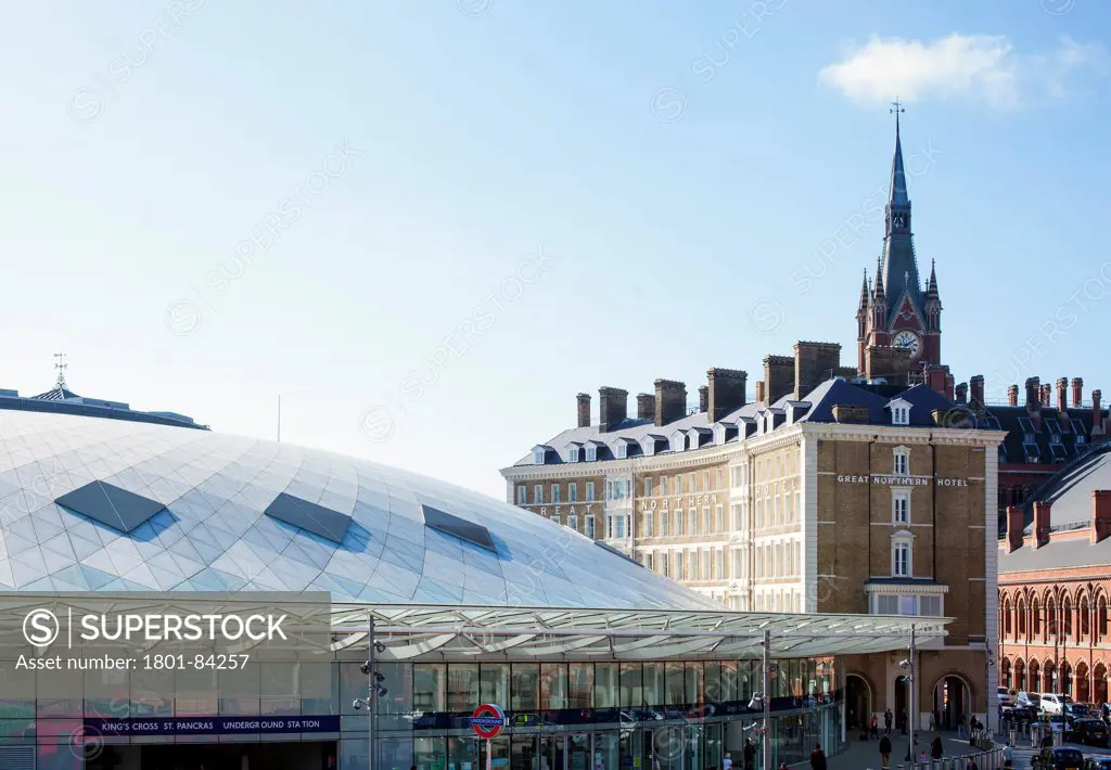 Great Northern Hotel, London, United Kingdom. Architect Dexter Moren Associates, 2013. View of the rear of the hotel where the building meets the new Kings Cross station concourse, St Pancras station can be seen to right with clock tower rising above.
