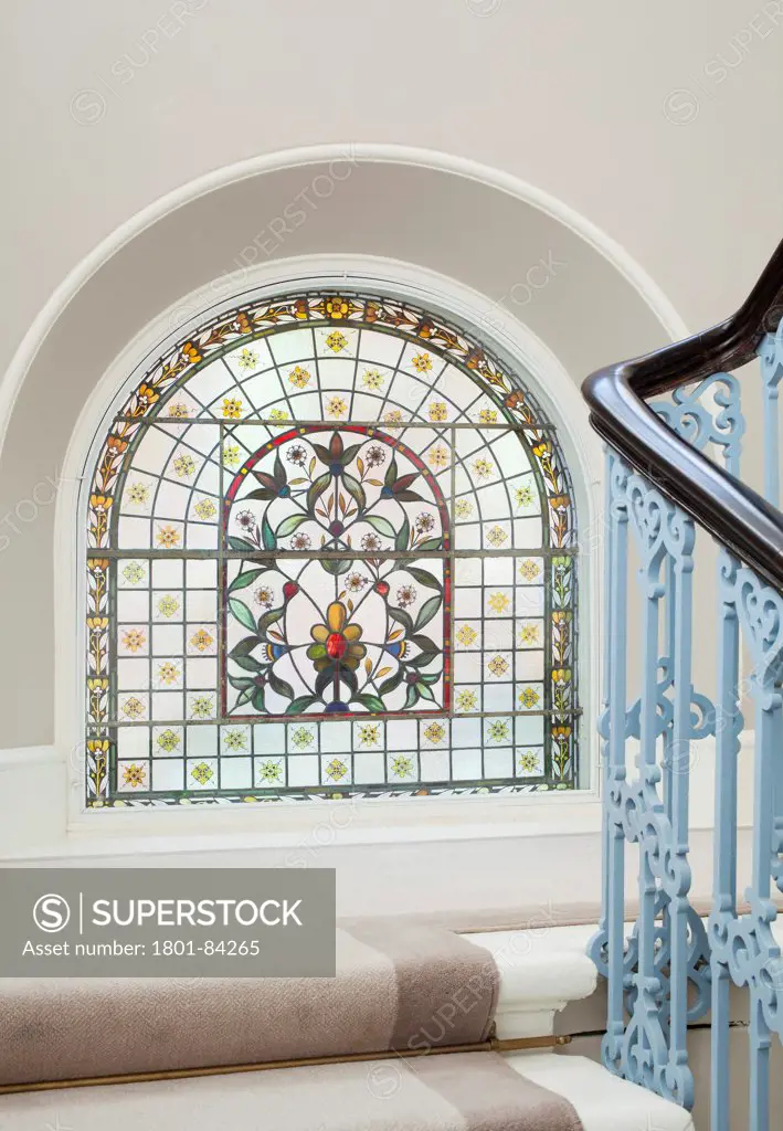 Great Northern Hotel, London, United Kingdom. Architect Dexter Moren Associates, 2013. Detail of the stained glass window on the landing of the staircase.