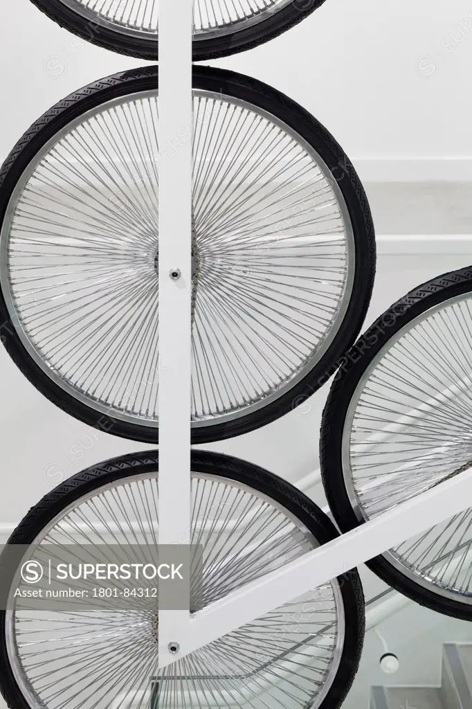 Le Coq Sportif London -FlagshipStore, London, United Kingdom. Architect Studio Oscar, 2013. Abstract detail of the wheels on the Kinetic Bicycle Sculpture.