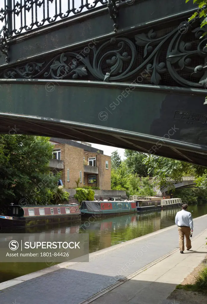 Narrowboat, London, United Kingdom. Architect Pete Young, 2013. View of boat with others under Broad Walk Bridge.
