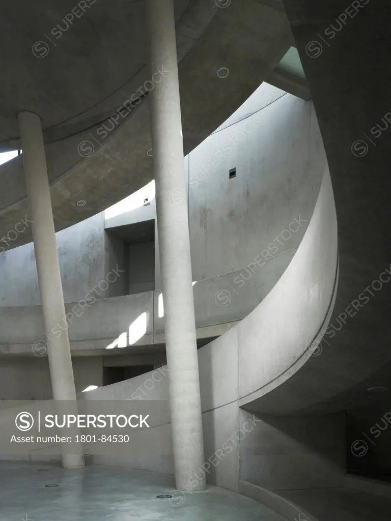 Alesia Museum, Alise-Sainte-Reine, France. Architect Bernard Tschumi Architects, 2012. Concrete interior with columns and ramp.