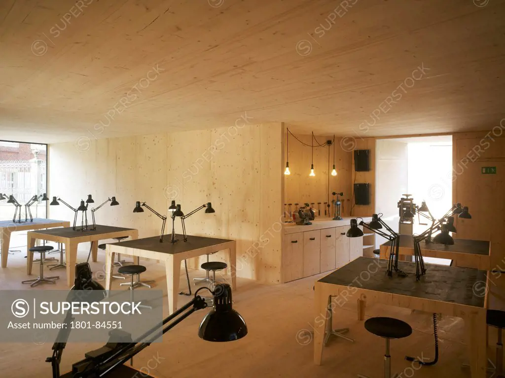 Goldene Pracht Pavillon, Muenster, Germany. Architect modulorbeat, 2012. Central workshop interior with bespoke plywood furnishings.
