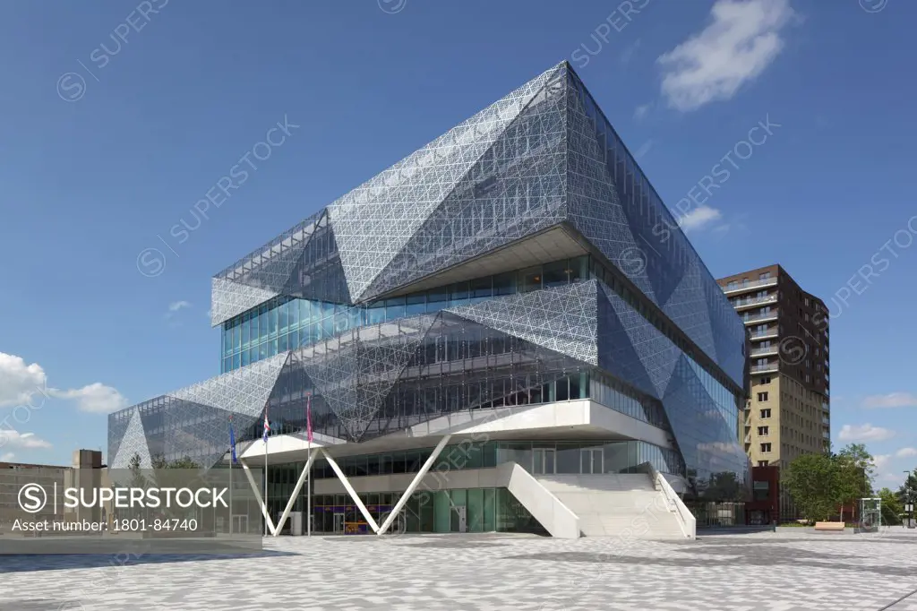 Exterior with glass patterned silkscreen against clear sky seen from Stadsplein