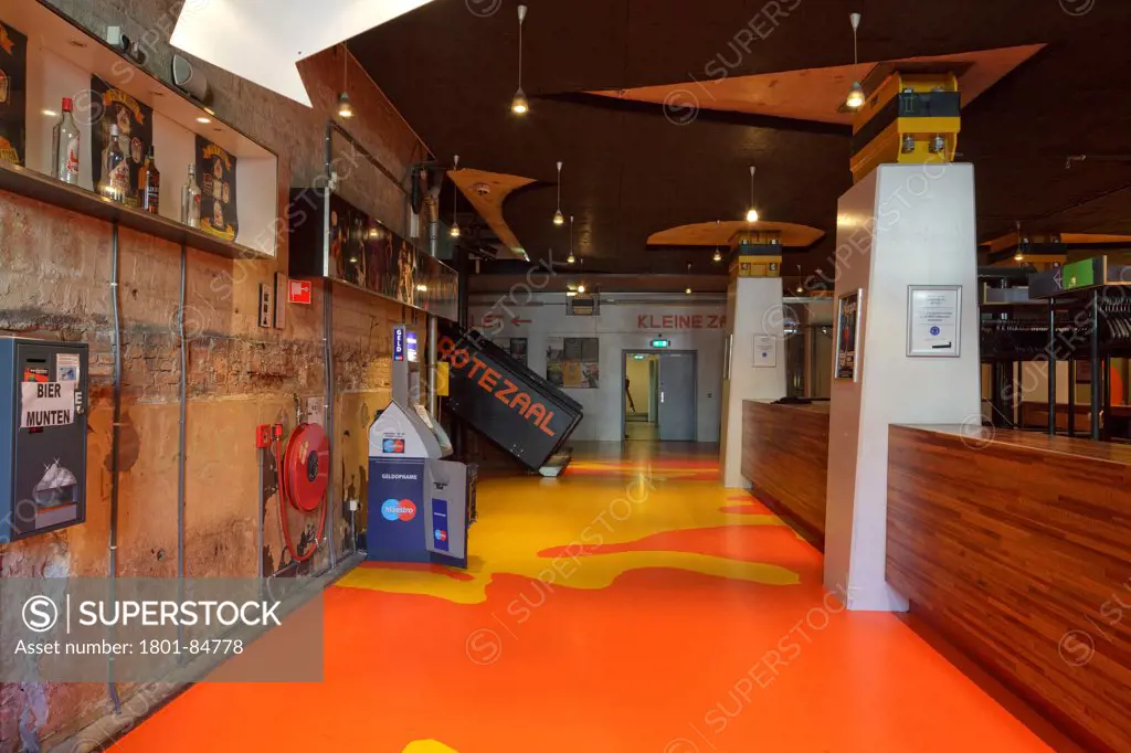 View of basement entrance foyer with orange and yelow patterned flooring