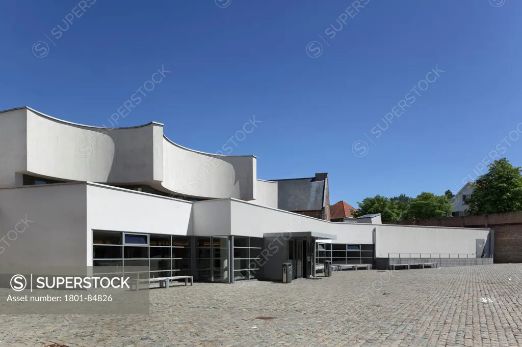 Main entrance to Library, with white render exterior against clear sky