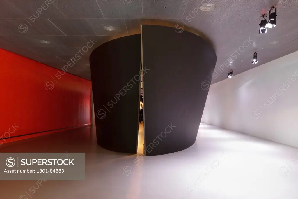 Display pod against red and white walls