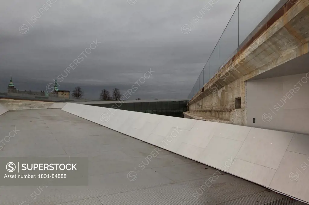 View up sloping entrance ramp towards Kronborg Castle against stormy sky