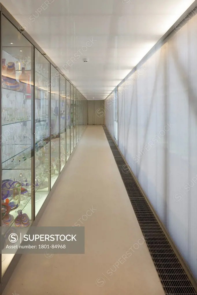 Interior of open storage bridge, with light through polycarbonate panels and display cases designed by Piet Hein Eek
