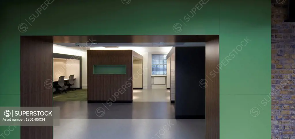 Royal College of Nursing, London, United Kingdom. Architect Bisset Adams, 2013. Colour accentuated entrance portal to office floor with drop-in work space.