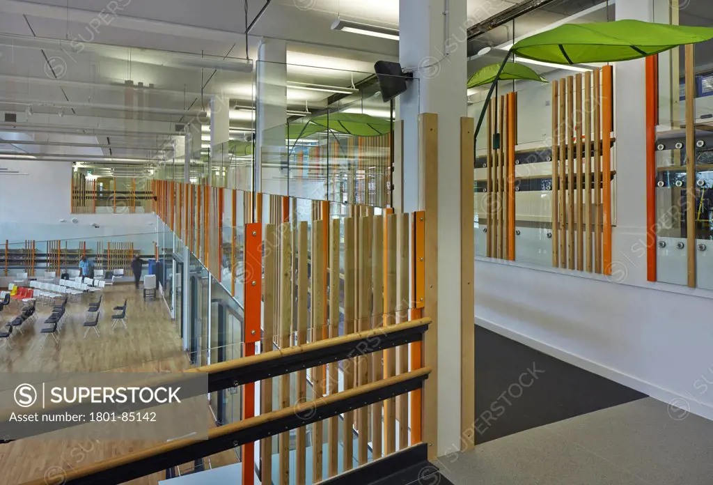 The Livity School, London, United Kingdom. Architect Haverstock Associates LLP, 2013. Elevated view into transparent multi-purpose hall.
