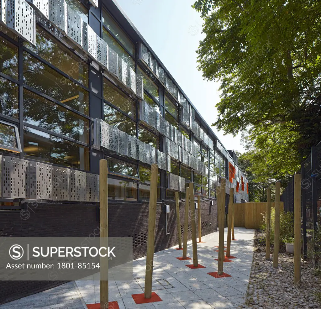 The Livity School, London, United Kingdom. Architect Haverstock Associates LLP, 2013. Perspective of dark brick, stainless steel cladding play area.
