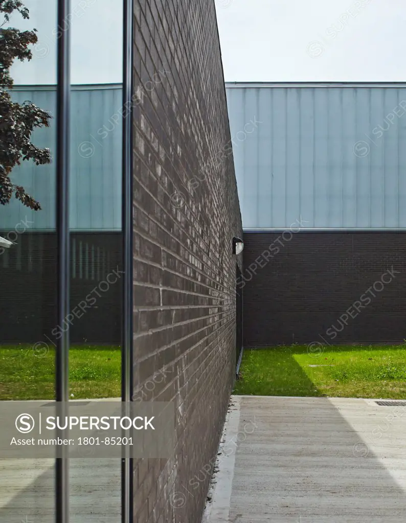 Wednesfield School, Wolverhampton, United Kingdom. Architect Capita Symonds Architecture, 2013. Exterior facade detail with glass and brickwork.