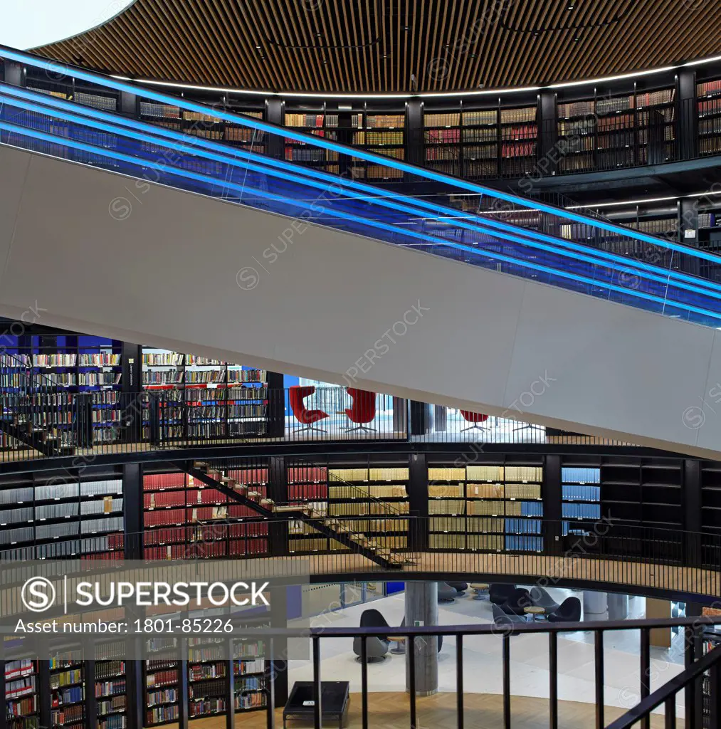 Library of Birmingham, Birmingham, United Kingdom. Architect Mecanoo , 2013. View to atrium with book rotunda and escalators.