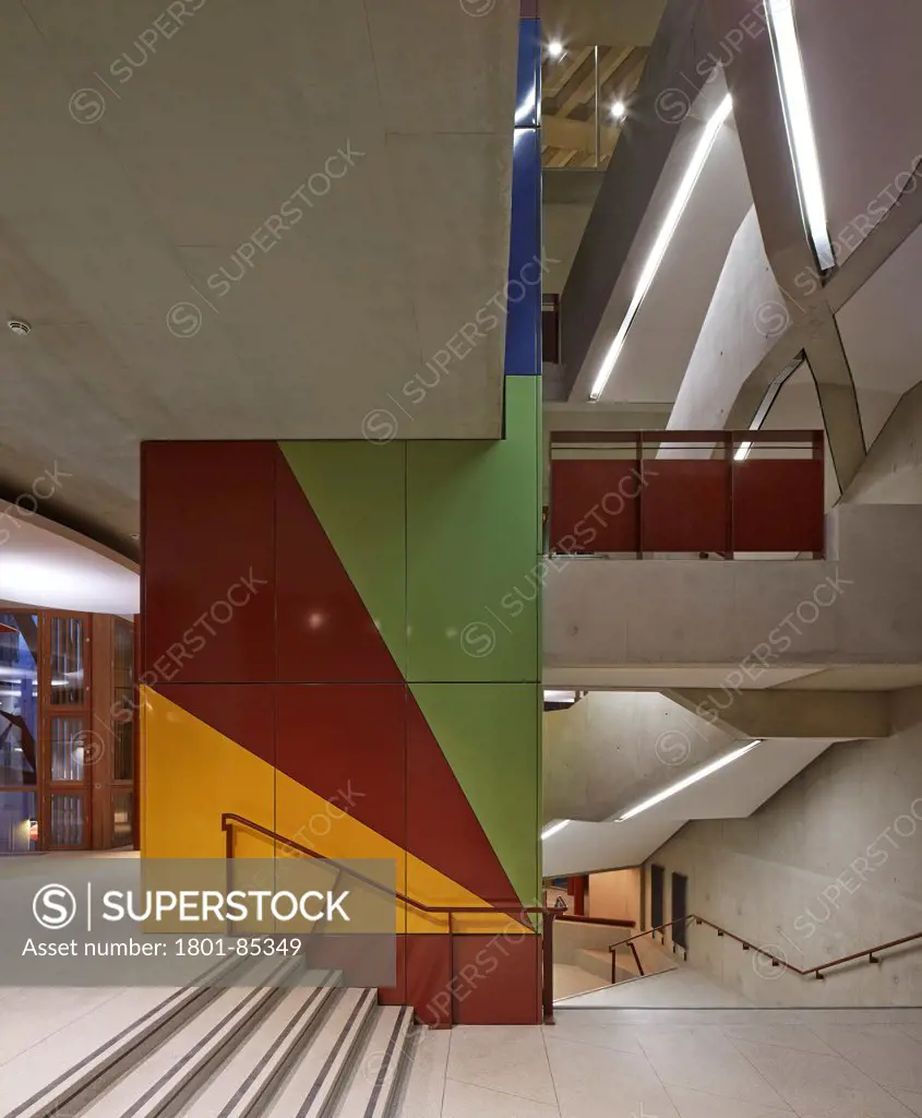 London School of Economics,Saw Swee Hock Students Centre, London, United Kingdom. Architect O'Donnell & Tuomey, 2014. Main staircase with multi-coloured clad elevator shaft.