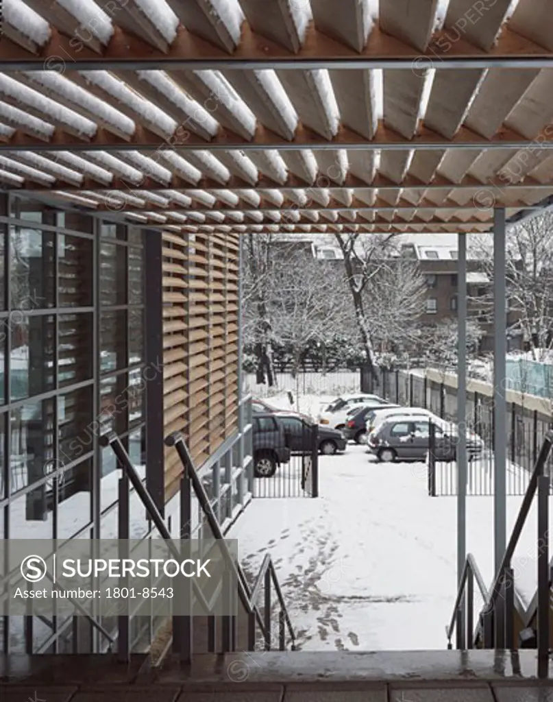 TALACRE COMMUNITY SPORTS CENTRE, DALBY STREET, LONDON, NW5 KENTISH TOWN, UNITED KINGDOM, TIMBER SCREEN AND BRISE SOLEIL FROM TERRACE TO CAR PARK WITH SNOW, DAVID MORLEY ARCHITECTS