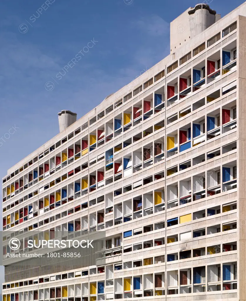 Unite D'habitation, Marseille, France. Architect Le Corbusier, 1952. Tight exterior view showing colorful balconies and rooftop ventilation shafts.