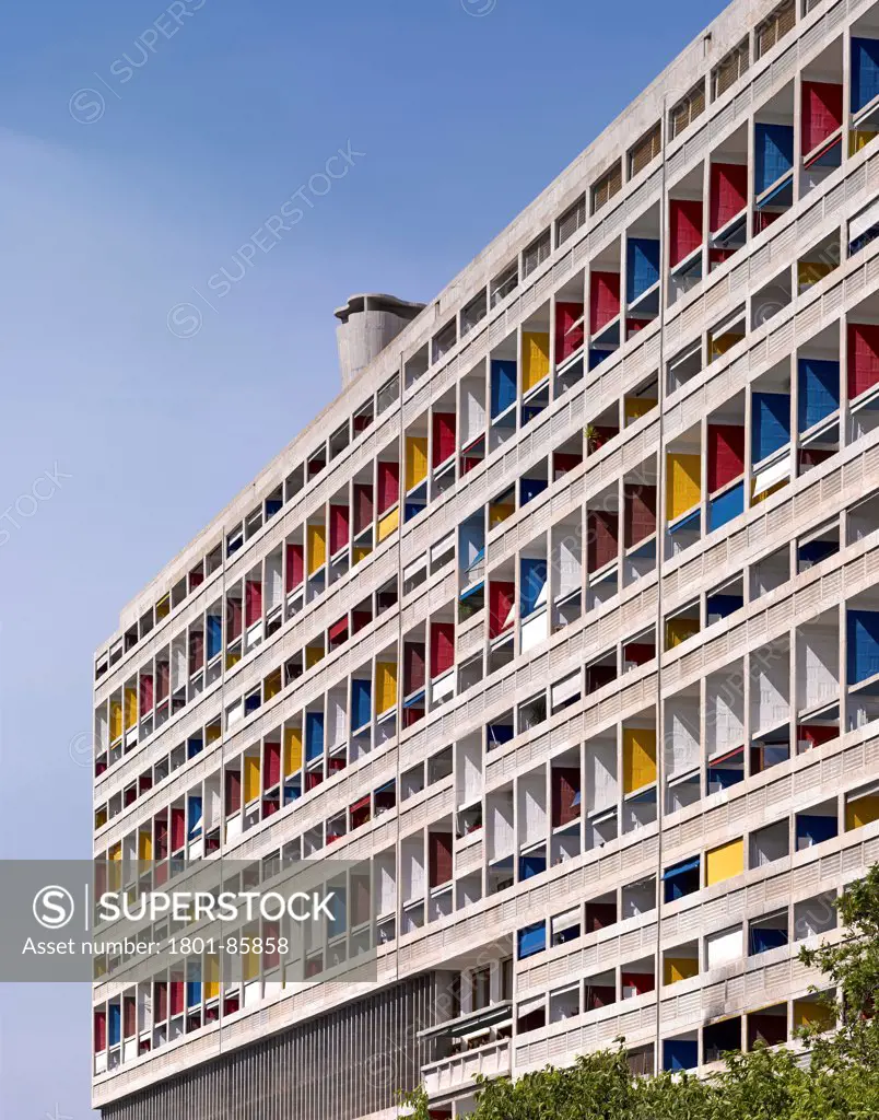 Unite D'habitation, Marseille, France. Architect Le Corbusier, 1952. Tight exterior view showing colorful balconies and rooftop Ventilation shafts.