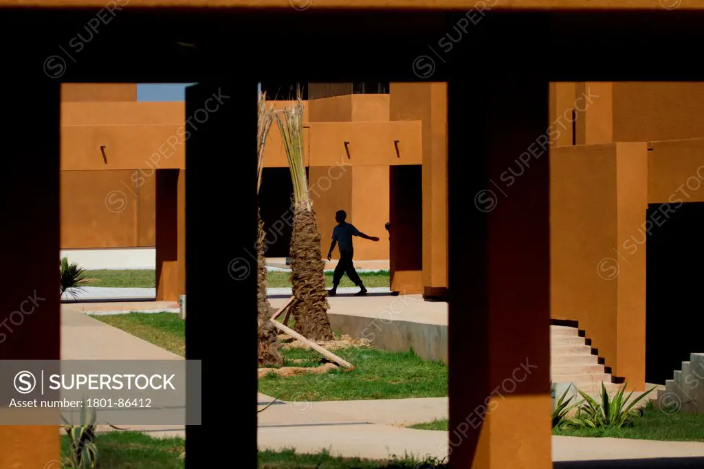 Taroudant University, Taroudant, Morocco. Architect Saad el Kabbaj, Driss Kettani, Mohamed Amine Siana, 2011. View through to gardens.