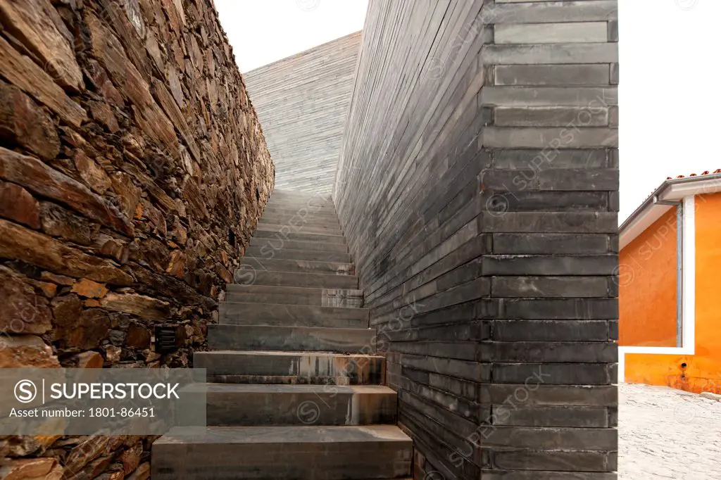 Quinta do Vallado Winery, Peso da Regua, Portugal. Architect Cristina Guedes and Francisco Vieira de Campos, 2013. Stone and shale wall with stairway.