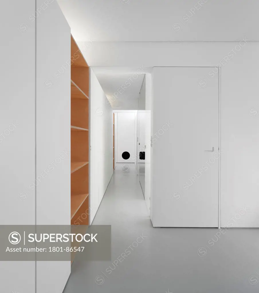 Apartment extension in Benfica, Lisbon, Lisbon, Portugal. Architect Hugo Proenca Arquitecto, 2012. Corridor view with cabinet and mirror wall.