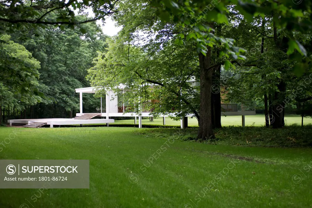 Farnsworth House, Plano, United States. Architect Ludwig Mies van der Rohe, 1951. General view of Farnsworth House in informal garden.
