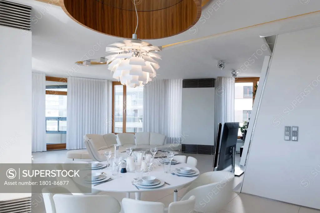 TRIO Apartment and Commercial building, Warsaw, Poland. Architect Jems Architekci, 2013. Dinning room as seen from the kitchen.