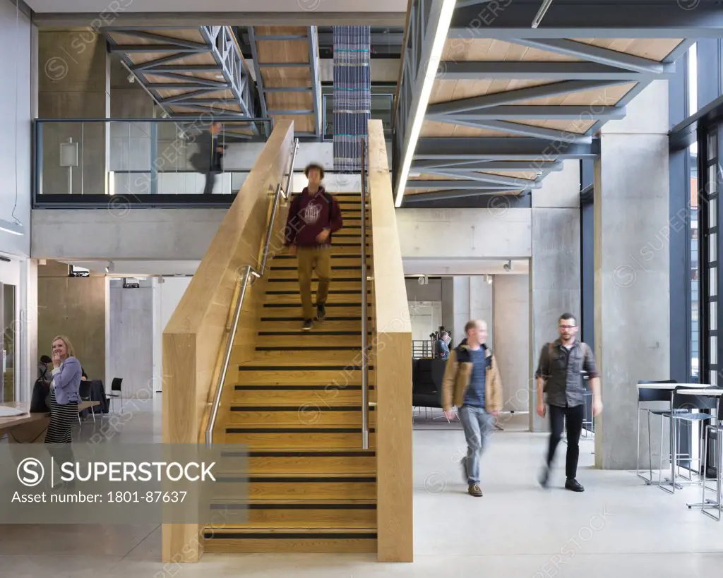 Manchester School of Art, Manchester, United Kingdom. Architect Feilden Clegg Bradley Studios LLP, 2013. View of staircase and ground floor space.