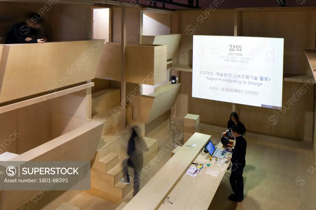 On-site' Hub, Gwangju, Korea, South. Architect Nilsson Pflugfelder, 2011. Elevated view to presentation space with desk.