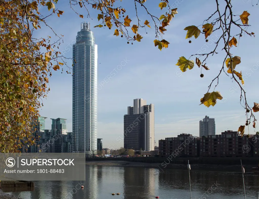 St George Wharf Tower, London, United Kingdom. Architect Barton Willmore, 2013. Wide shot from north bank through trees.
