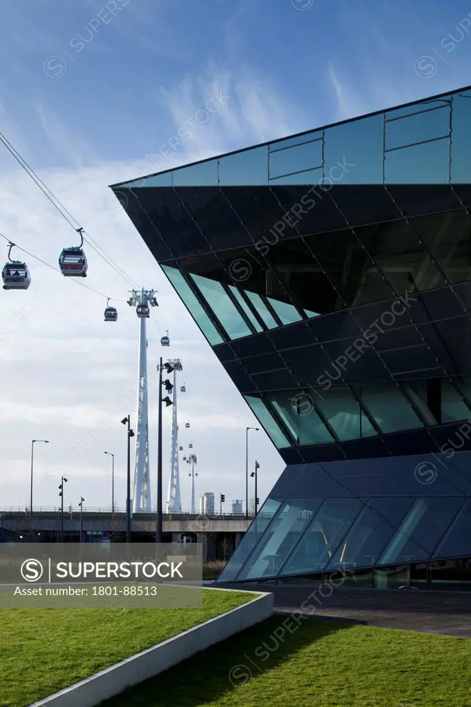 The Crystal, London, United Kingdom. Architect Wilkinson Eyre, 2013. Close partial view of east elevation with cable cars in background.