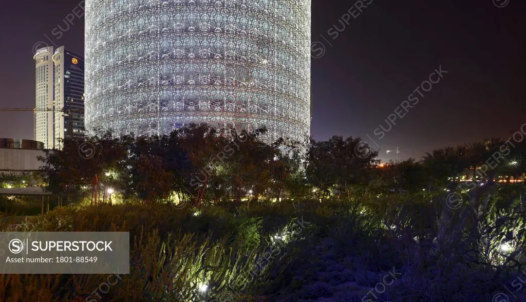 Burj Qatar, Doha Tower, Doha, Qatar. Architect Ateliers Jean Nouvel, 2012. Night view with sourrounding vegetation.