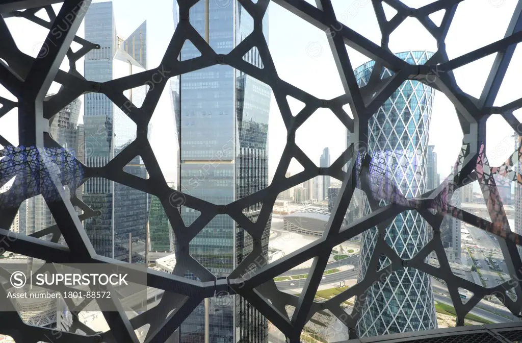 Burj Qatar, Doha Tower, Doha, Qatar. Architect Ateliers Jean Nouvel, 2012. View of the Mashrabiya from interior, buildings (Vortex Tower, Palm Towers) outside the curtain wall.