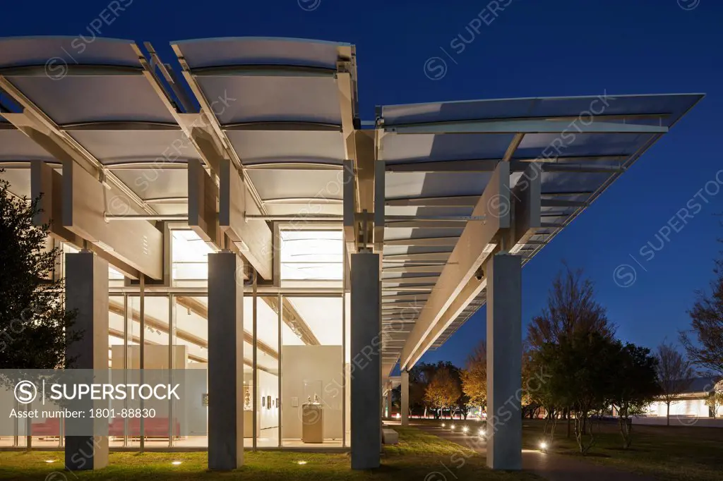 Kimbell Art Museum Renzo Piano Expansion, Fort Worth, United States. Architect Renzo Piano Building Workshop, 2013. Night elevation of glazed facade and exterior canopy.