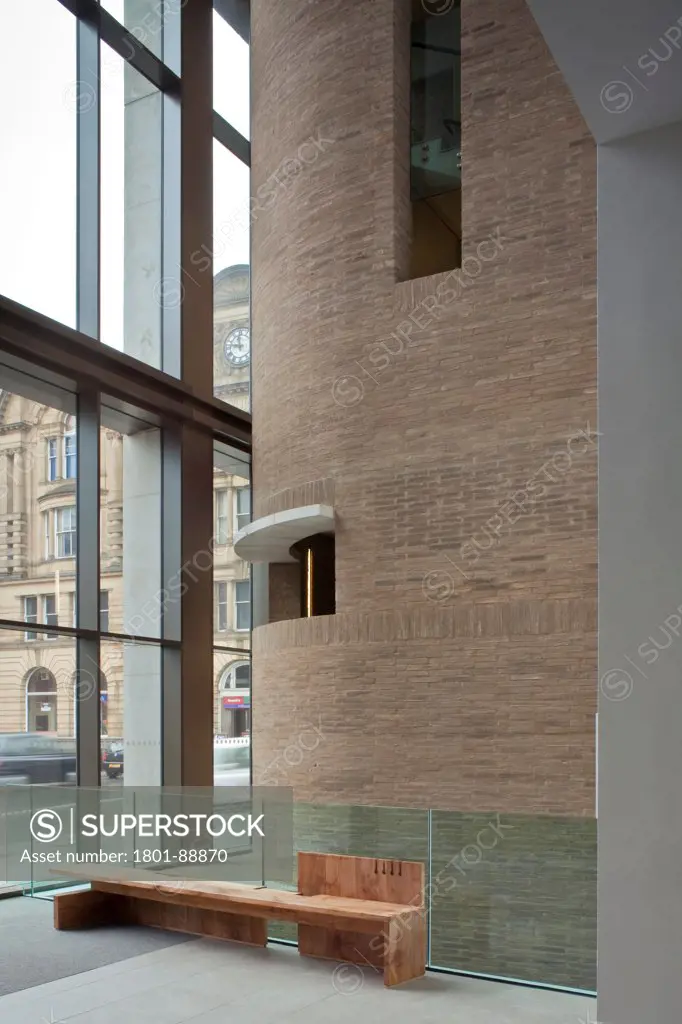 Chetham's School of Music, Manchester, United Kingdom. Architect Stephenson ISA Studio, 2013. View out showing Manchester Victoria train station and the apertures of the staircase brick envelope.
