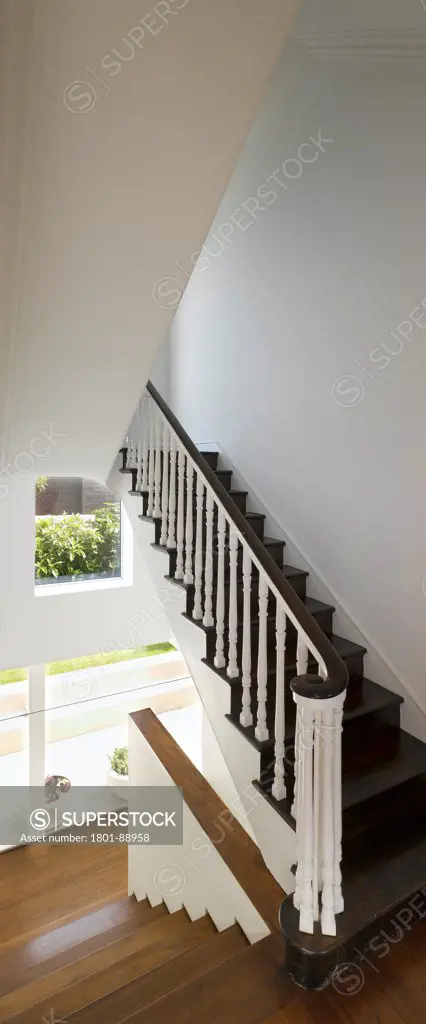 Dublin Raumplan House and Garden, Dublin, Ireland. Architect John Feely Architects, 2012. Panoramic view of remodeled staircase at ground level.