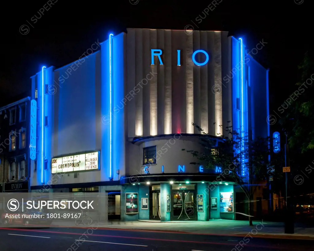 Rio Cinema, London, United Kingdom. Architect Burrell Foley Fischer LLP + F E Bromige, 1937. Corner elevation from Kingsland High Street at night.