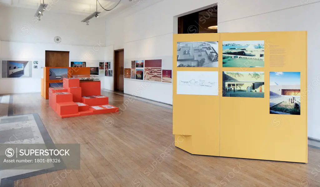 RIBA, Charles Correa Exhibiton, London, United Kingdom. Architect: Grey Wornum, 2013. View through exhibition spaces with display modules.