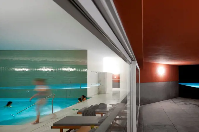 Vidago Palace & Spa, Vidago, Portugal. Architect: Alvaro Siza-Vieira, 2012. View From Outdoors To Indoor Pool.