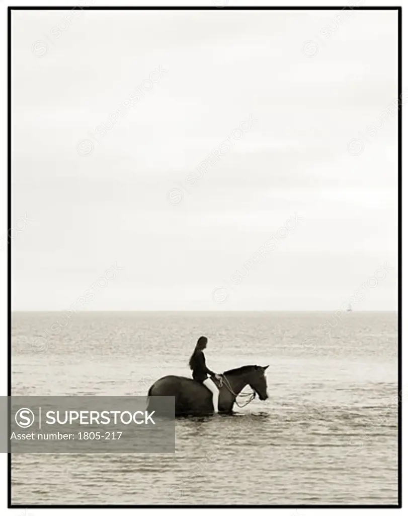 Riding a horse by John Kuss, Photograph