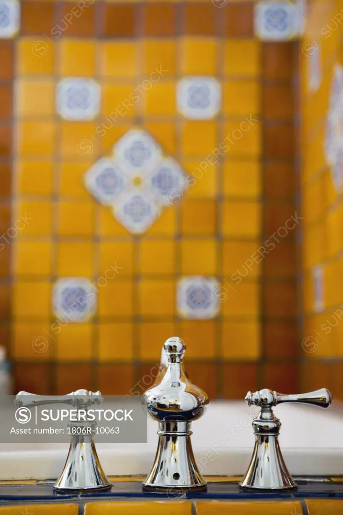 Bathroom Faucet in Brightly Tiled Bathroom