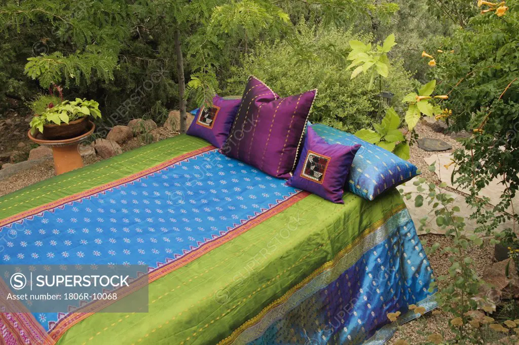 Colorful bedding on outdoor bed